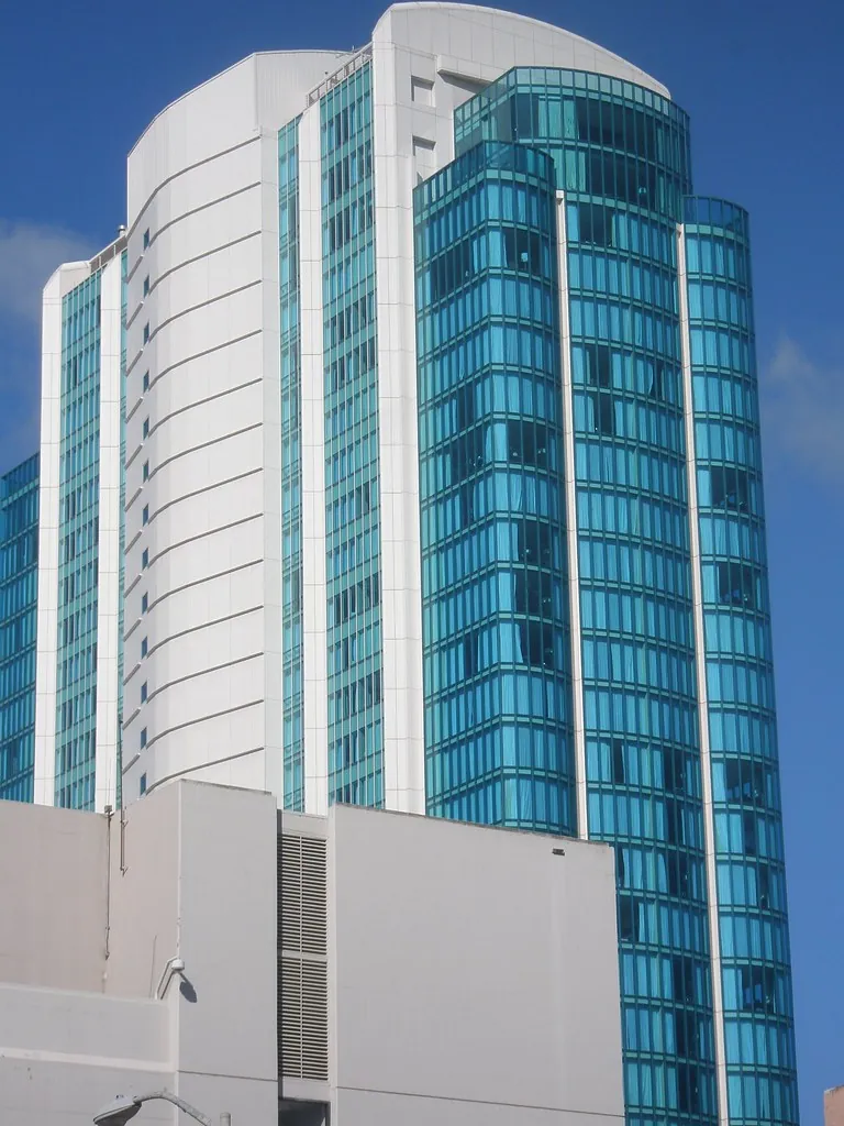 Modern commercial office tower with glass curtain wall